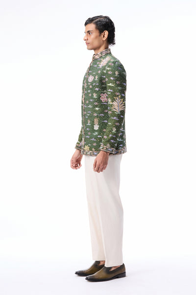 Elegant profile view of the applique embellished raw silk bandhgala.