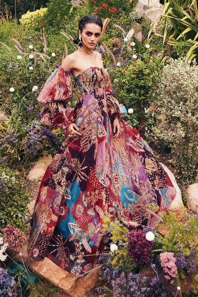Right view of Aisha Rao off-shoulder plum printed gown