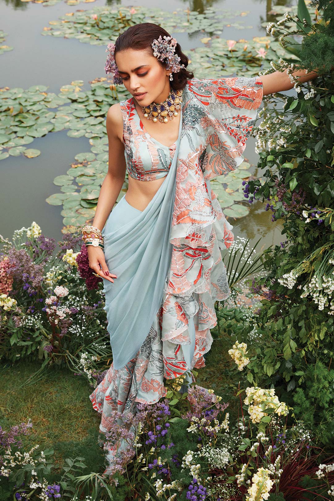 Woman wearing Aisha Rao powder blue ruffled saree and blouse