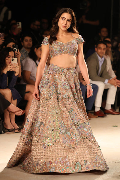 Hemline detail showcasing brocade finish and applique edging.