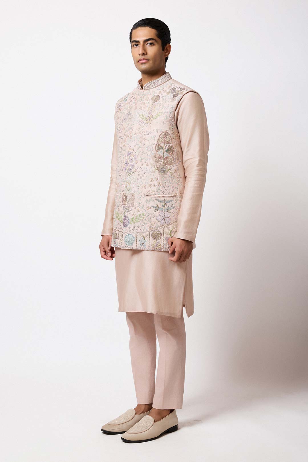 Man wearing Aisha Rao baby pink raw silk bundi front view

