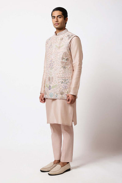 Man wearing Aisha Rao baby pink raw silk bundi front view

