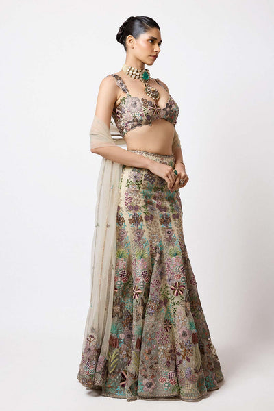 Woman in beige Aisha Rao bustier right side profile