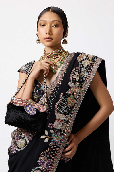 Close-up of black crepe applique and embroidery front