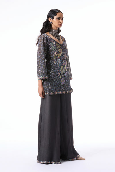 “Applique embellished gunmetal tulle kurta paired with chiffon sharara and sheer tulle dupatta.”