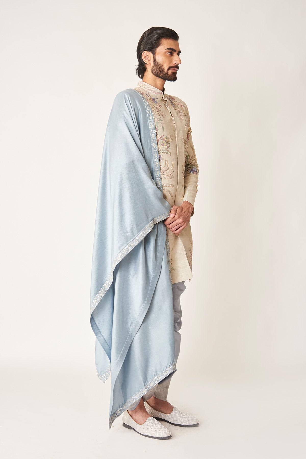 Right view of ivory sherwani, dhoti & shawl