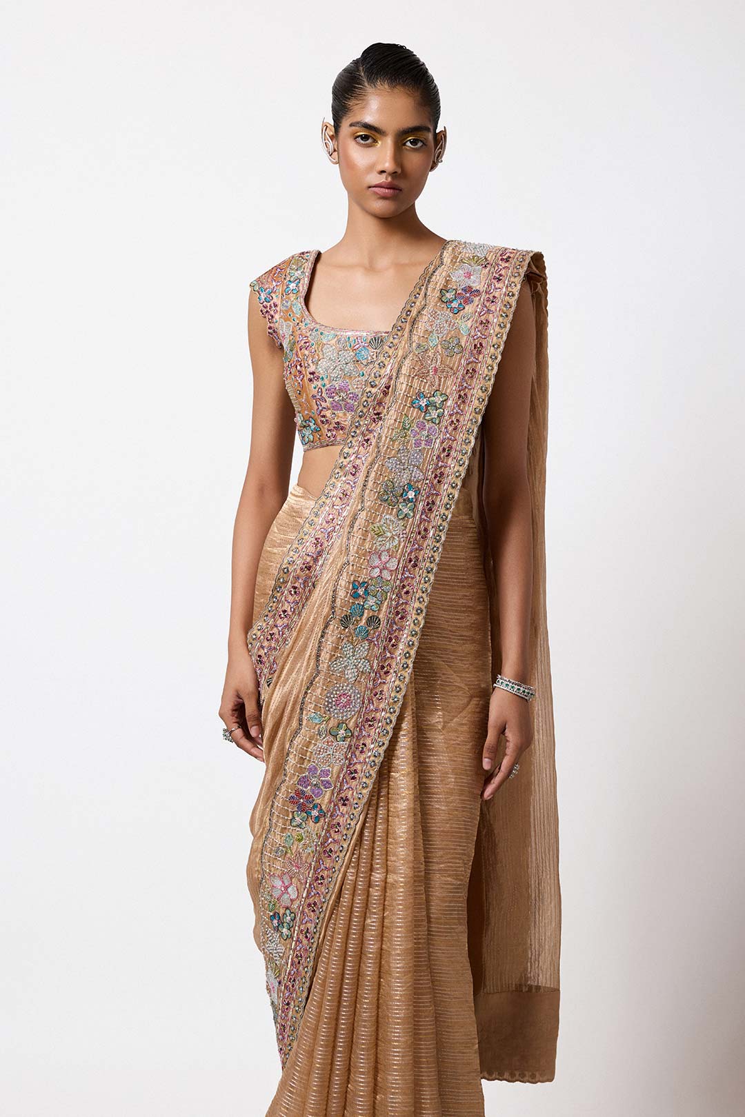 Woman in embellished tissue brocade outfit right profile