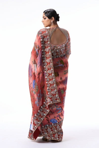 Back profile of the cantaloupe-rust printed viscose organza saree paired with a raw silk blouse.