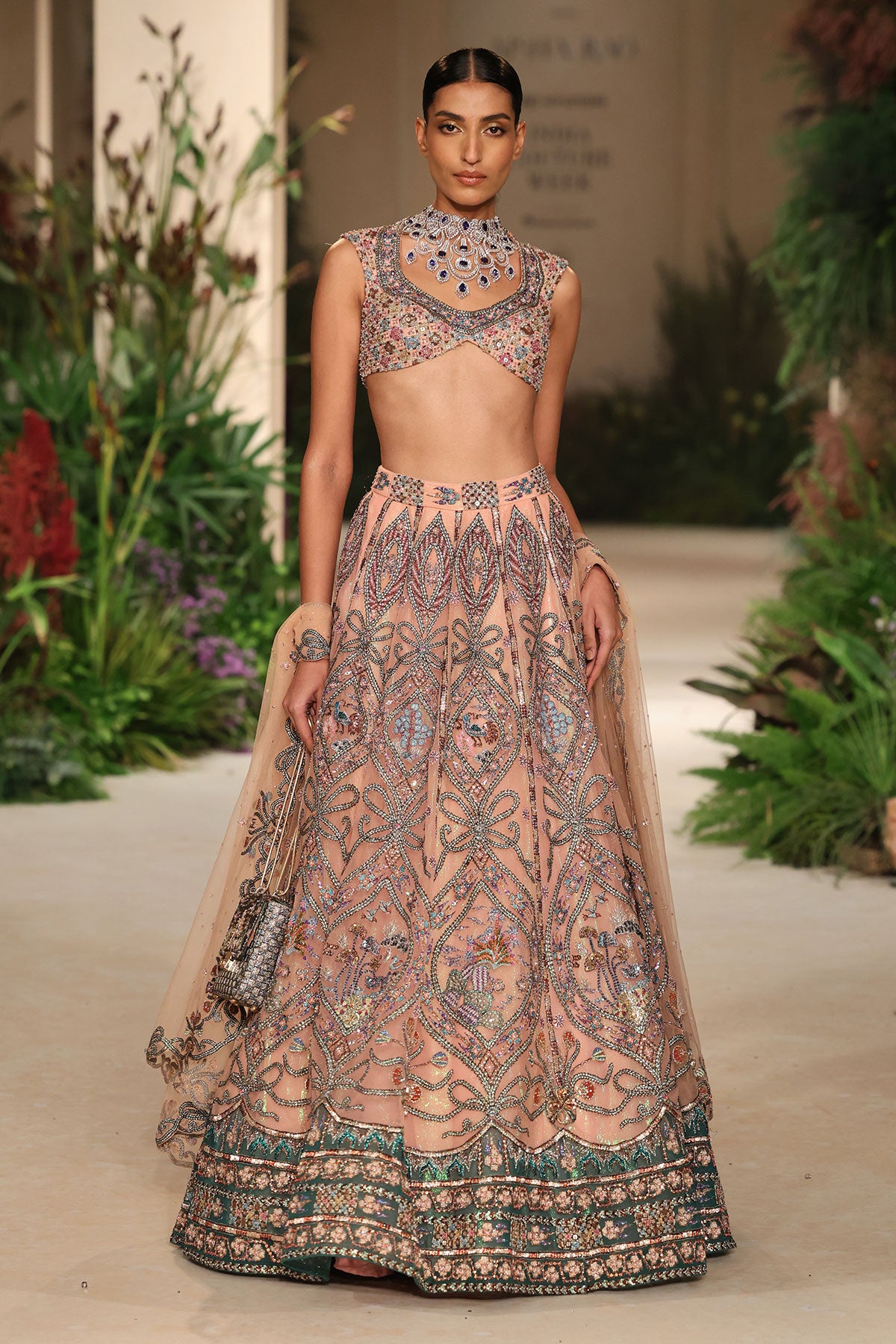 
Over-the-shoulder styling shot of the tulle lehenga with blouse and dupatta.