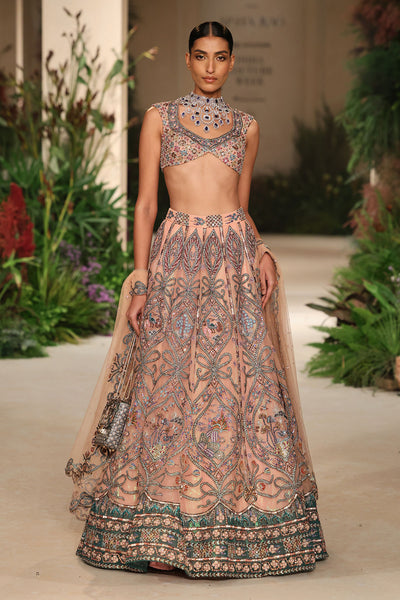 
Over-the-shoulder styling shot of the tulle lehenga with blouse and dupatta.