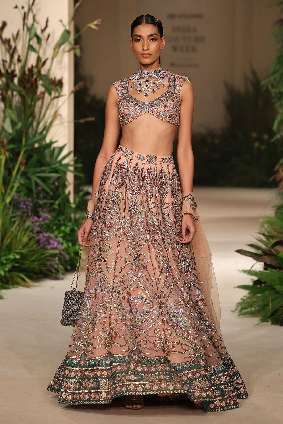 Detailed view of the tulle panels crafted in cantaloupe-teal gradient tones.