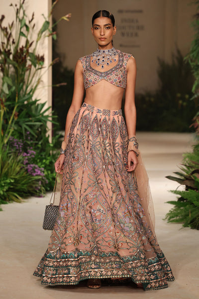 Detailed view of the tulle panels crafted in cantaloupe-teal gradient tones.