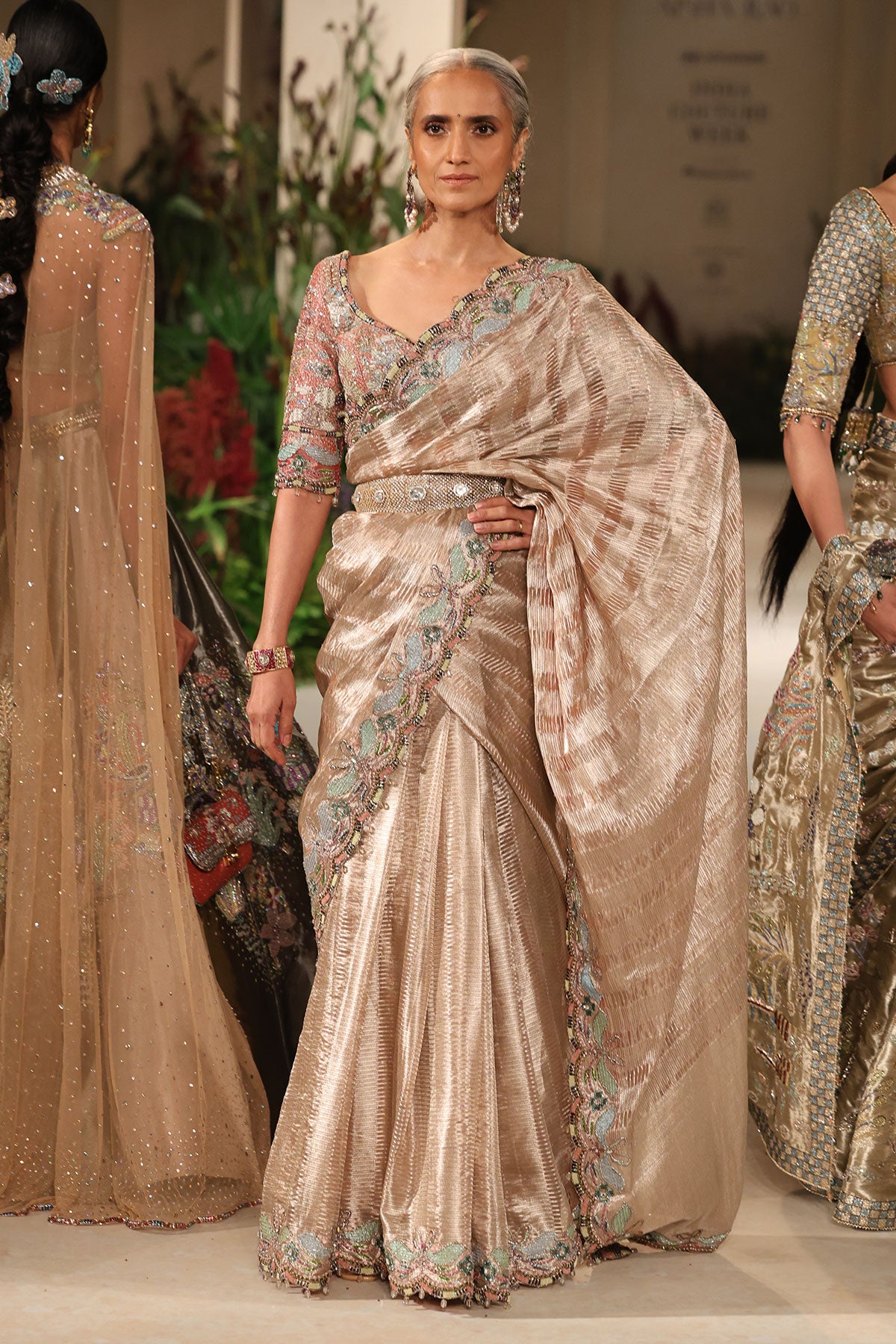 “Champagne pink Banarasi tissue brocade saree featuring rich brocade texture, soft sheen and detailed traditional border work.”