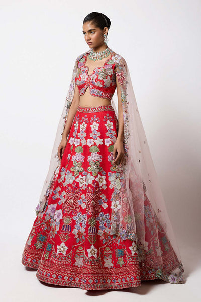 Woman in Rosso Corsa red lehenga side profile view