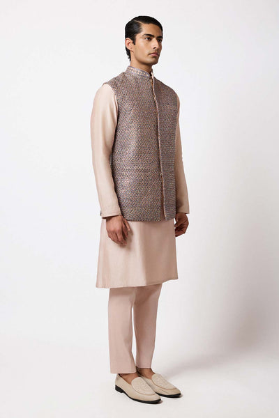 Weave detail of the gold raw silk bundi showcasing subtle texture.