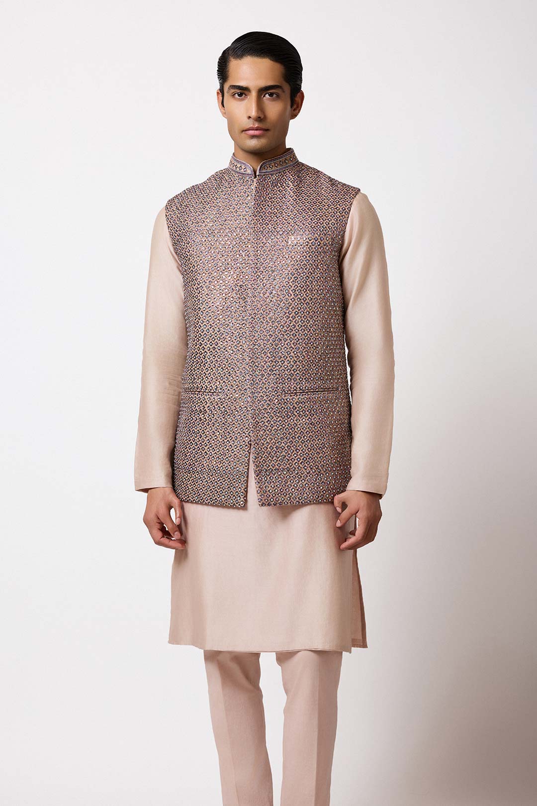 Model shot featuring the gold raw silk bundi styled for special occasions.