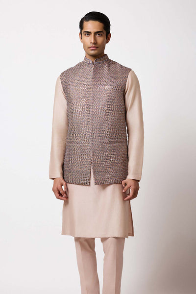 Model shot featuring the gold raw silk bundi styled for special occasions.