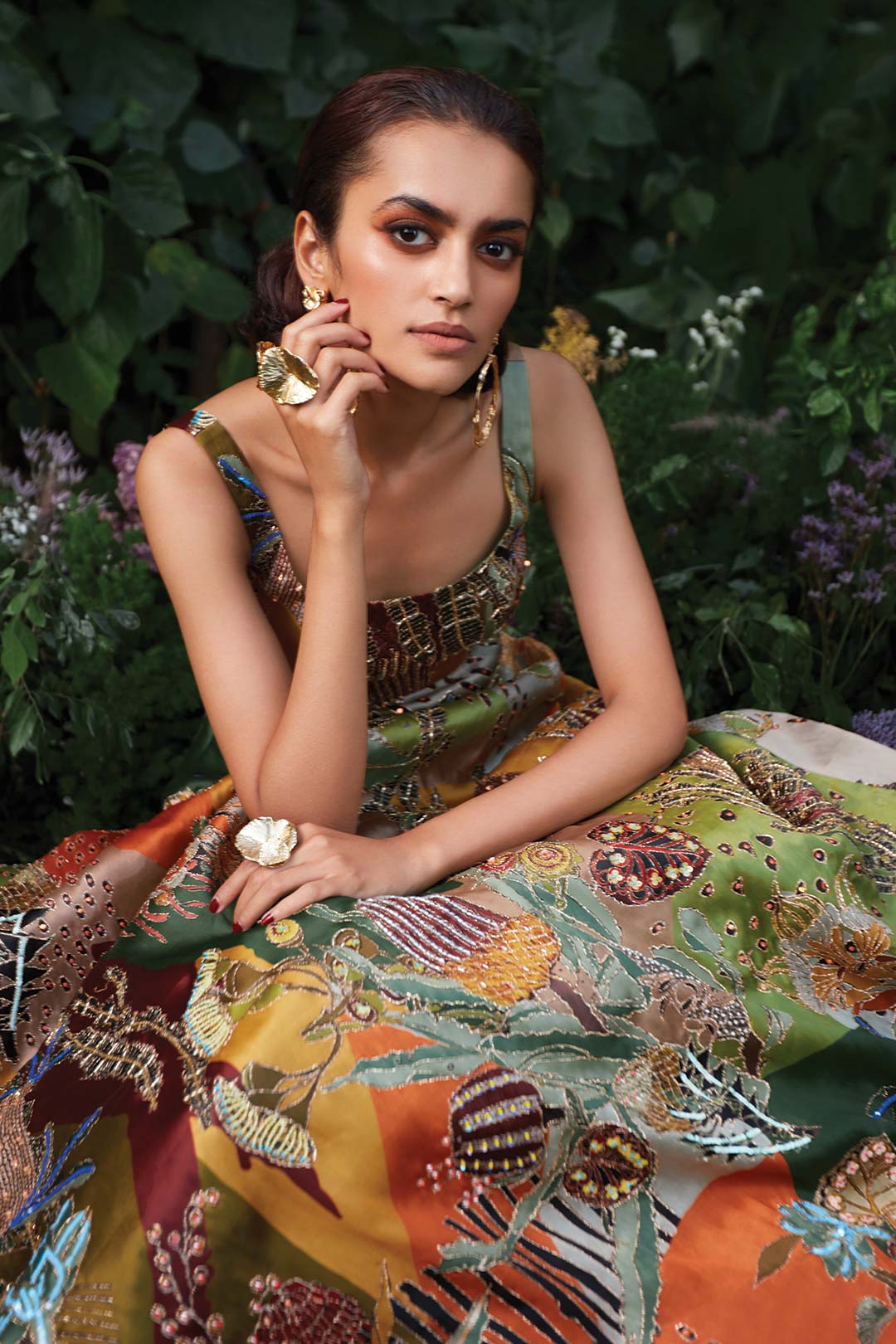 Close-up of green floral print and neckline Aisha Rao gown