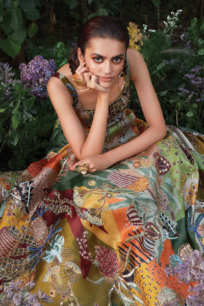 Close-up of neckline and fabric texture on Aisha Rao green gown