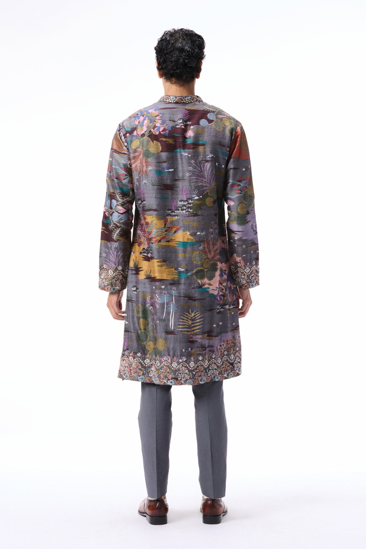 Back profile of the gunmetal printed raw silk kurta styled with twill poplin pants.