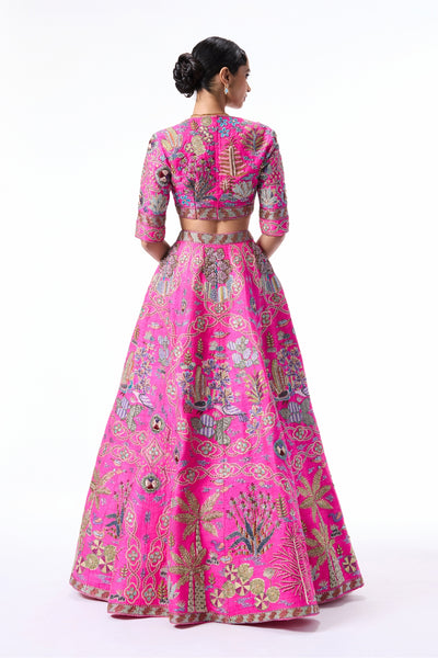 Back profile of the hot pink raw silk lehenga showcasing refined finishing and clean panels.