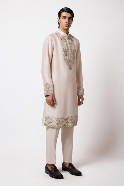 Woman wearing Aisha Rao ivory dupion silk lehenga front view