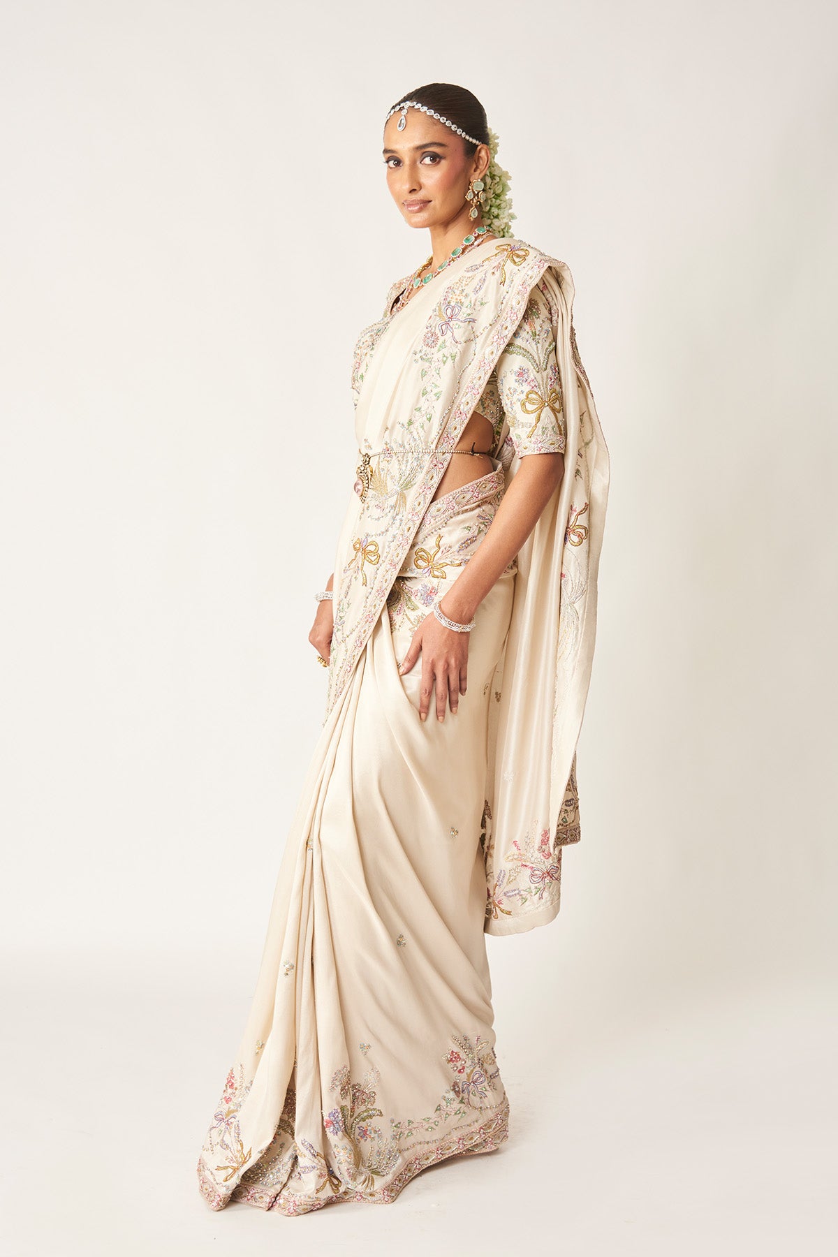 Side drape of ivory silk saree from the left