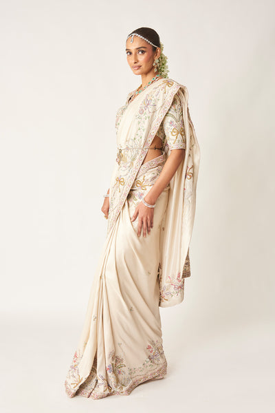 Side drape of ivory silk saree from the left