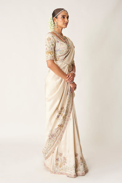 Right profile of ivory embellished dupion saree