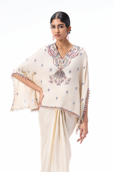Closeup of the applique embellished ivory dupion silk short tunic kurta.