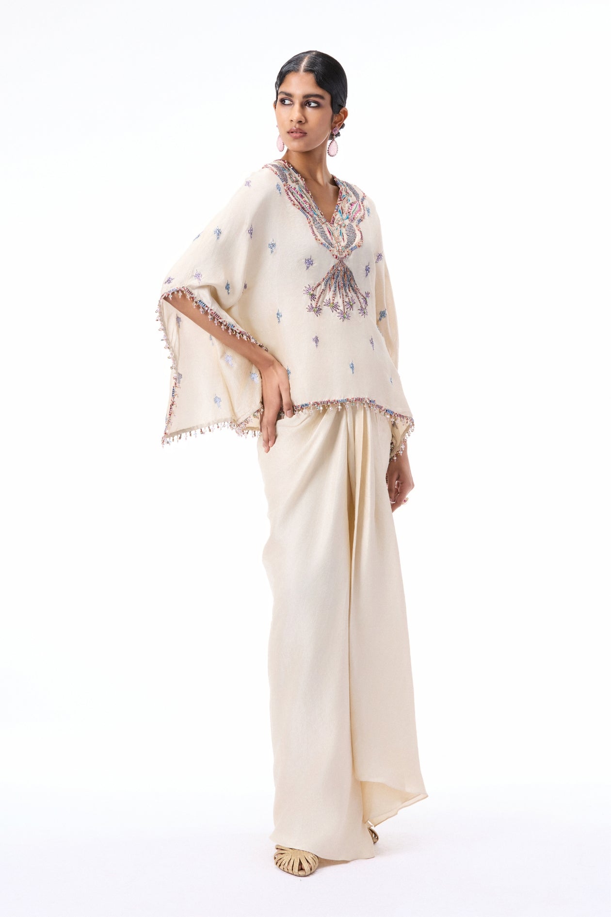 Styled look of the Wild At Heart ivory dupion silk tunic and draped skirt ensemble.