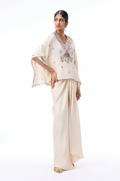 Styled look of the Wild At Heart ivory dupion silk tunic and draped skirt ensemble.