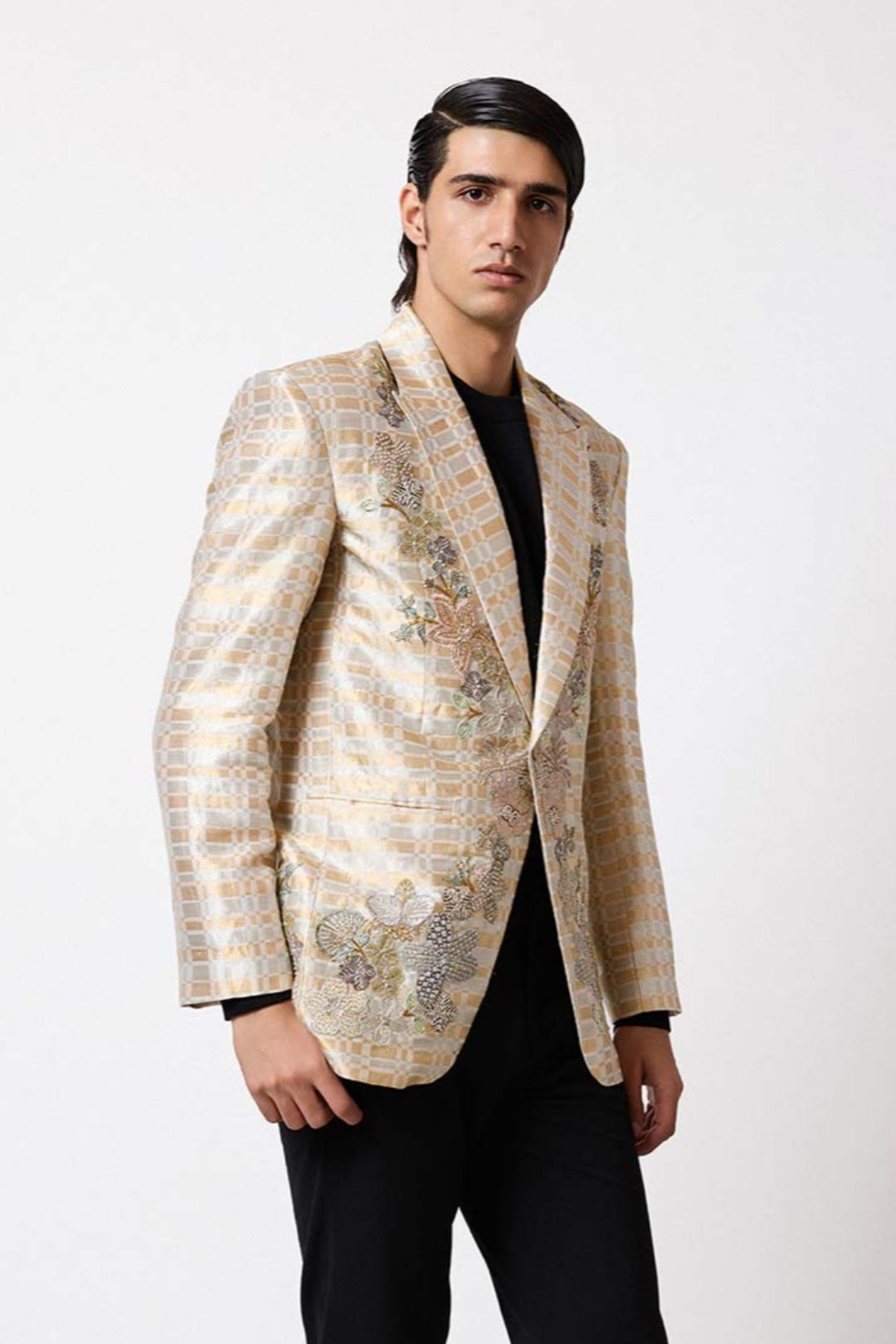 Woman wearing Aisha Rao ivory gold tissue lehenga front view