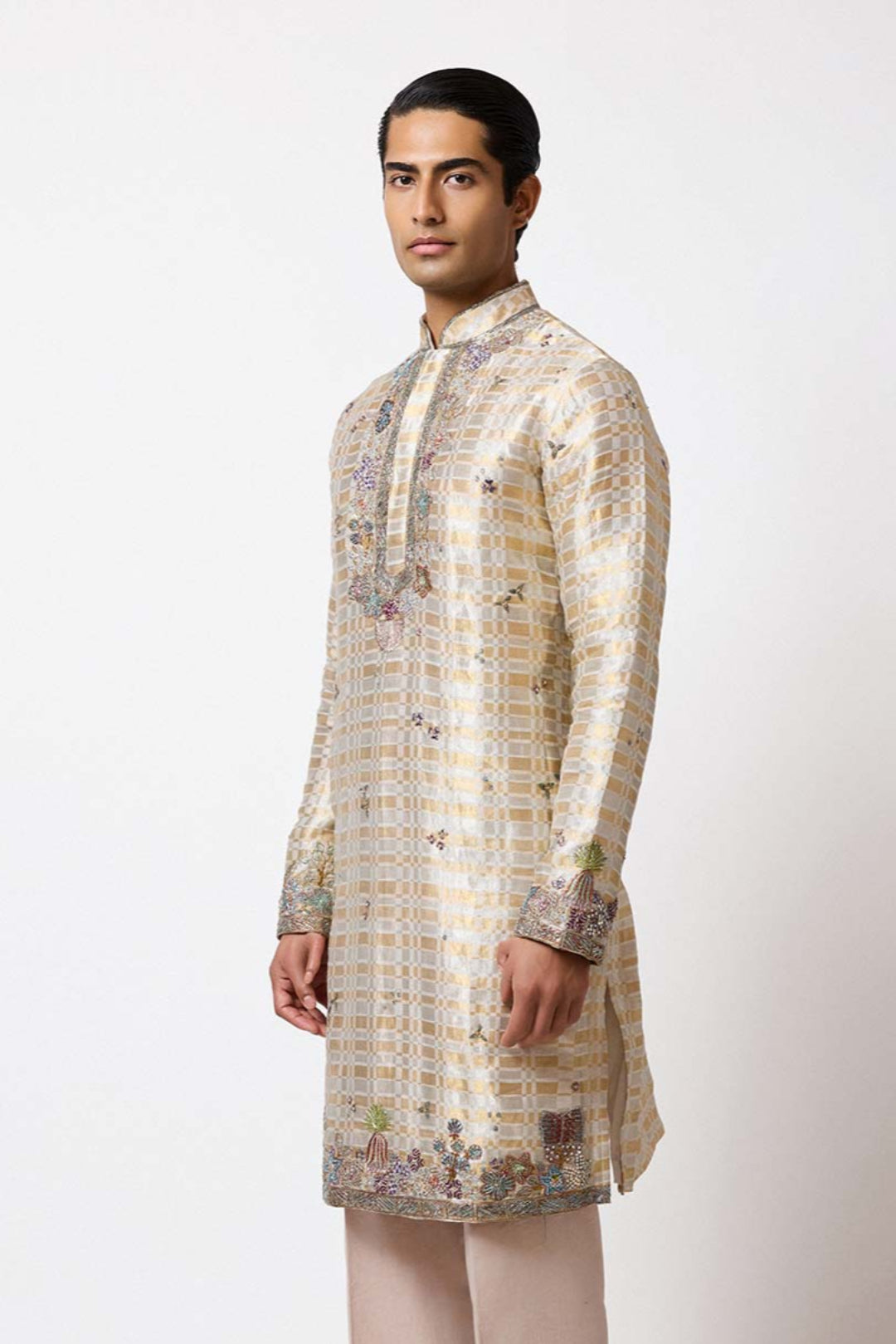 Woman wearing Aisha Rao ivory gold tissue lehenga front view