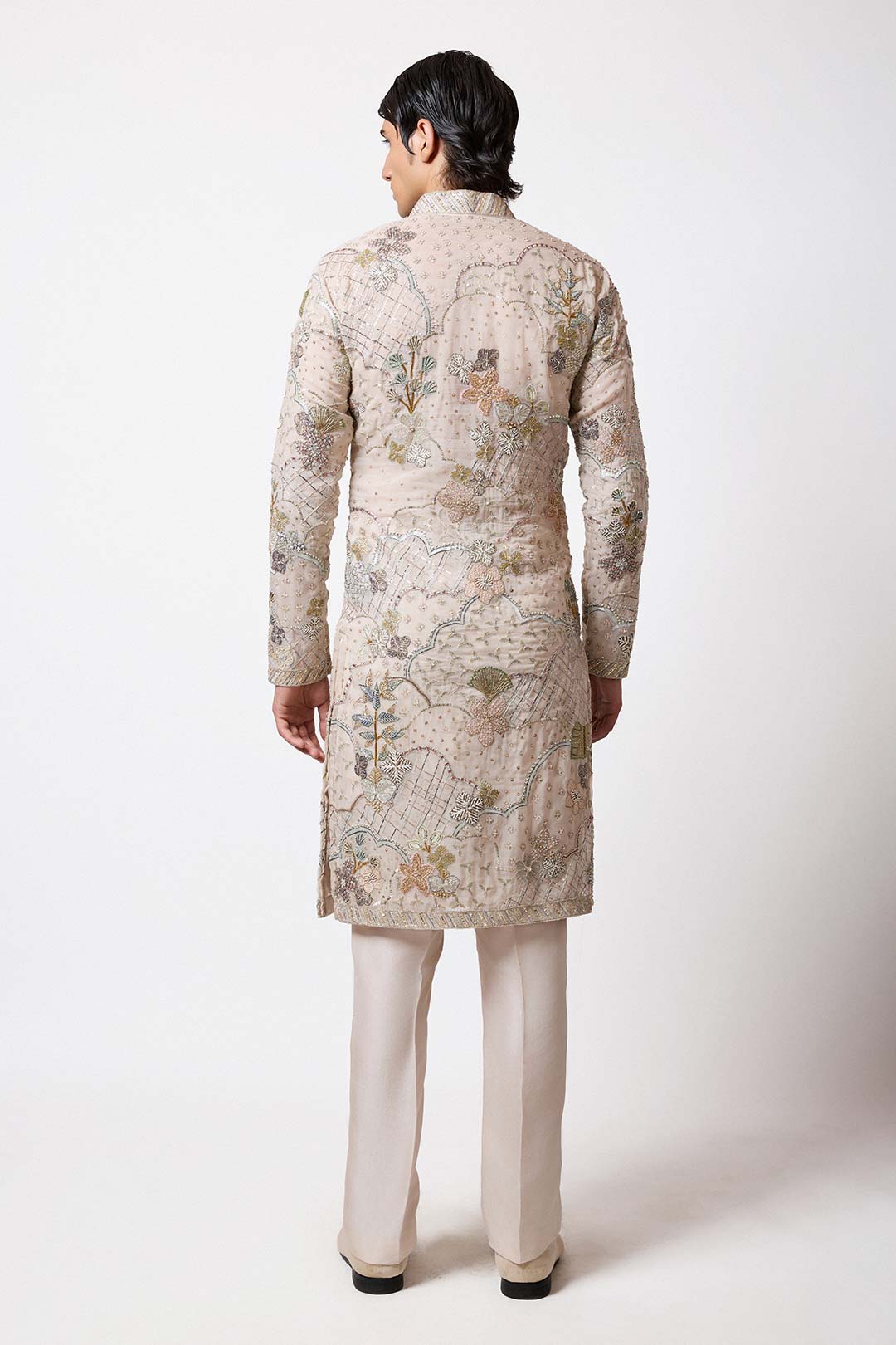 Close-up of applique work and scallop design right sleeve