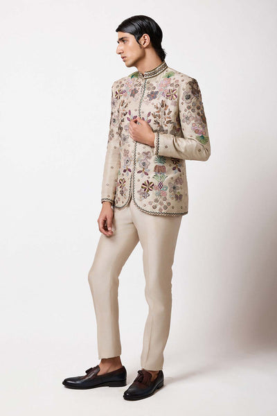 Man in embellished raw silk bandhgala right profile view