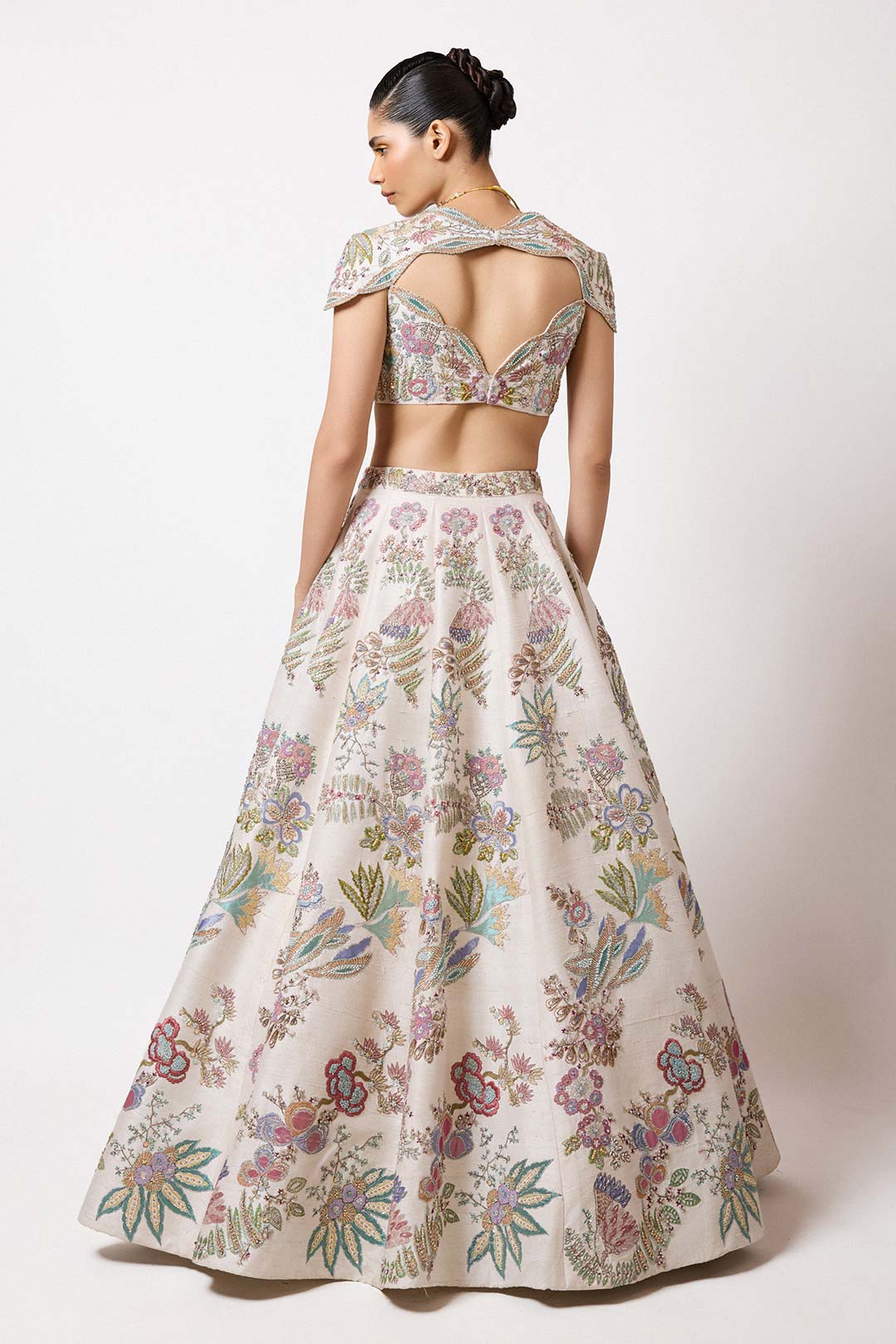 Right side view of Aisha Rao ivory VB lehenga and blouse