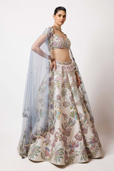 Woman in raw silk VB lehenga and blouse left profile view