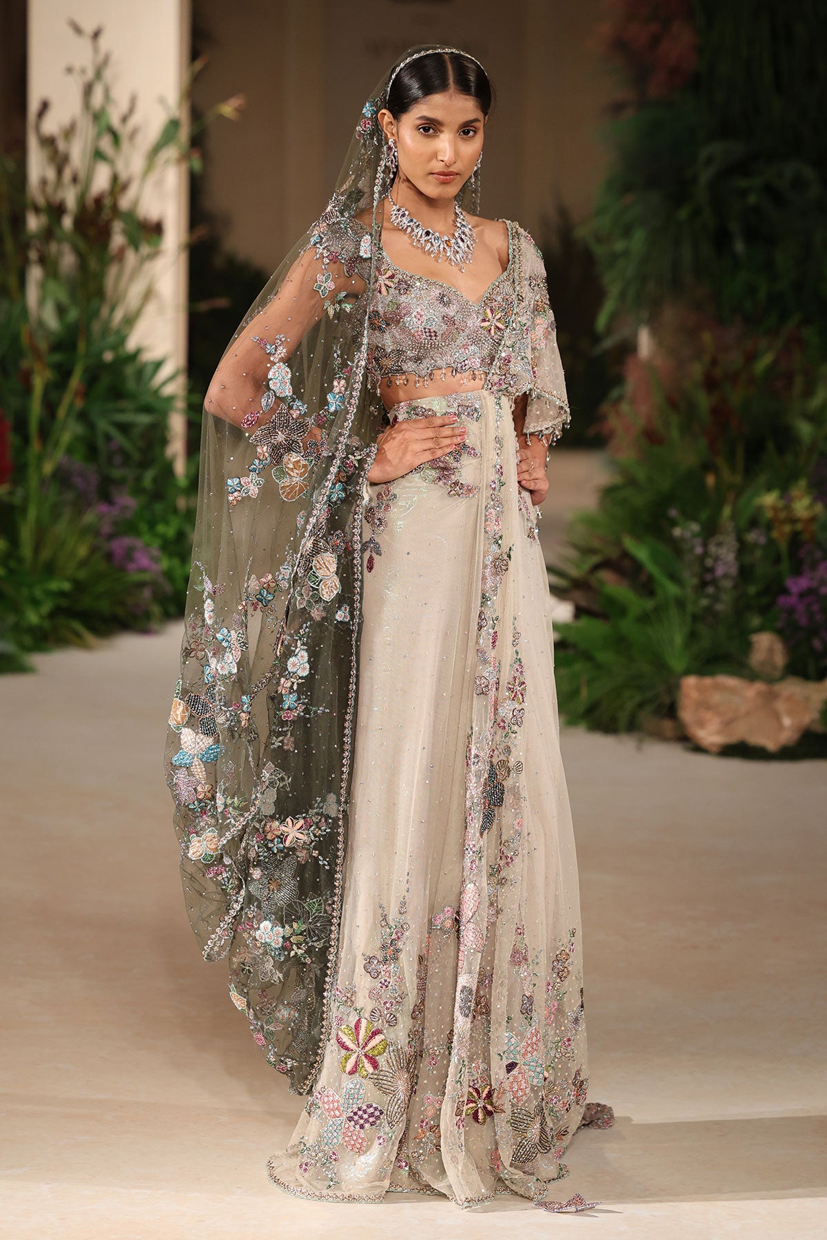 Ivory tulle drape saree with delicate draping and lightweight sheer tulle detailing.