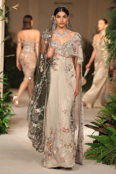 “Ivory tulle drape saree featuring soft layered tulle and an elegant fluid silhouette.”