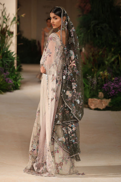 “Sheer ivory tulle drape saree with delicate pleating and modern styling.”