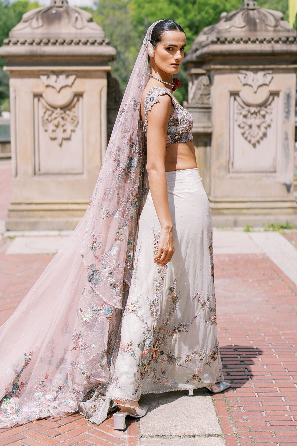 Side view of ivory ombre lehenga by Aisha Rao, left angle