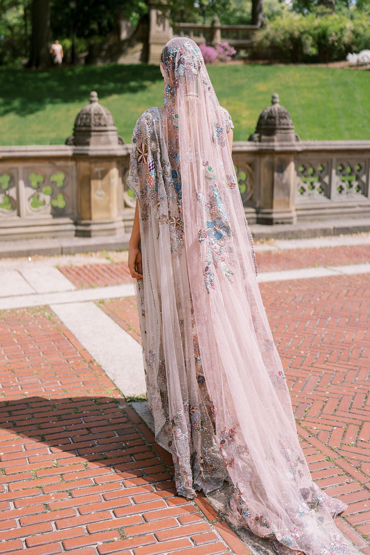 Woman in ombre embellished saree by Aisha Rao back view