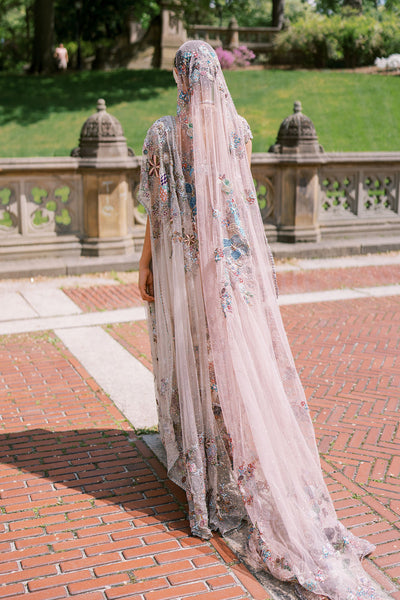 Woman in ombre embellished saree by Aisha Rao back view