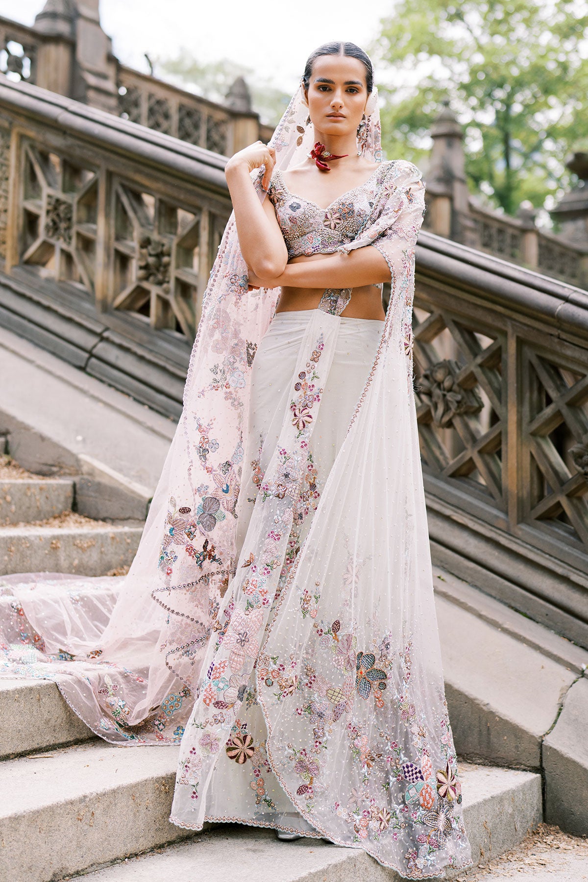 Woman wearing Aisha Rao pink ombre pre-draped tulle saree