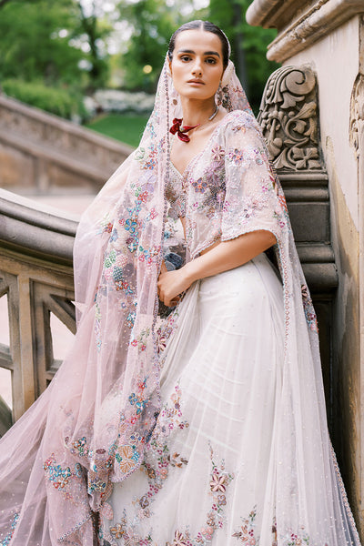 Applique work close-up left side of pink ombre saree