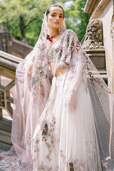 Woman wearing Aisha Rao ivory-pink ombre lehenga, front view

