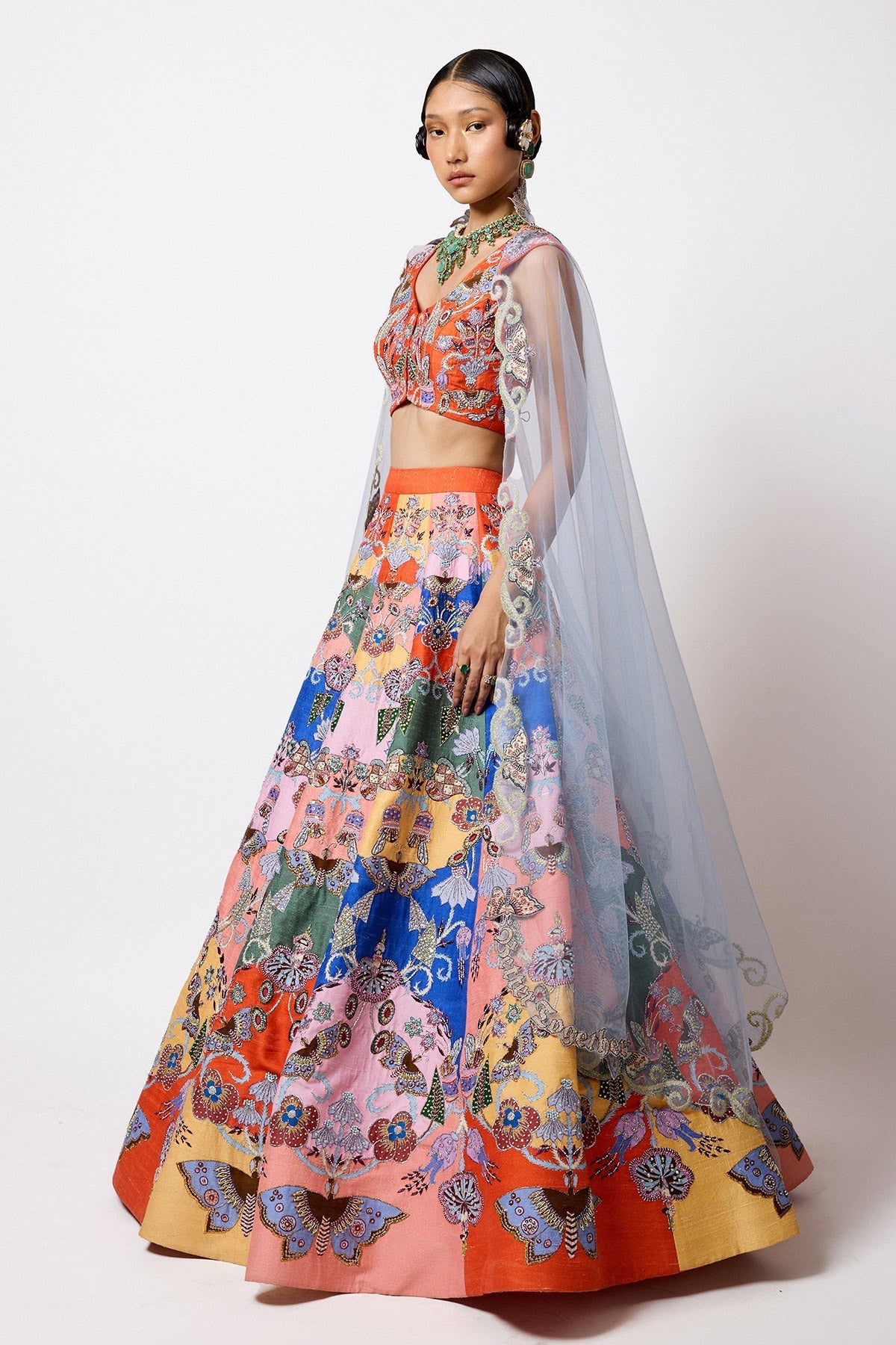 Woman in Aisha Rao embellished lehenga back profile