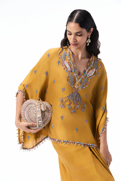 Wild At Heart mustard dupion silk set shown in a full front view with an applique embellished short tunic kurta and pleated draped skirt.