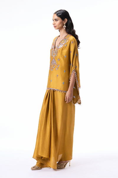 Closeup of the applique embellished mustard dupion silk short tunic kurta.